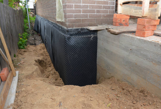 Happy homeowners after waterproofing job in Grafton